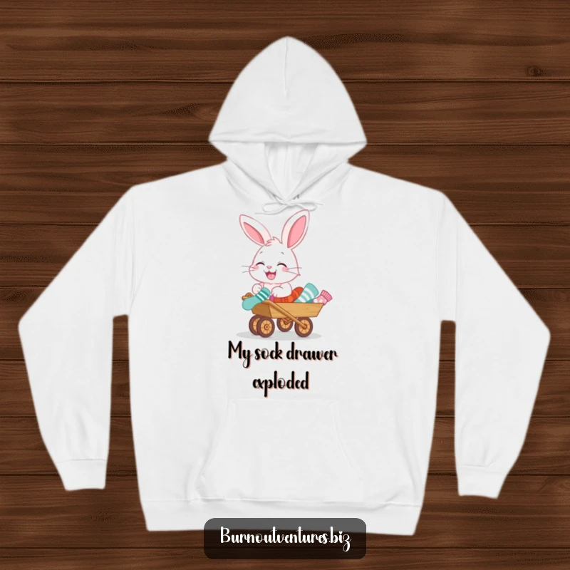 Funny hoodie featuring a happy bunny pushing a tiny wheelbarrow filled with a jumble of odd socks, a comical scene.